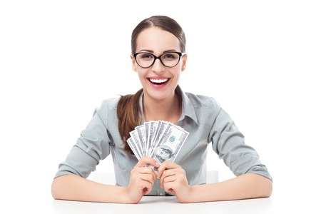 Smiling woman holding $100 bills