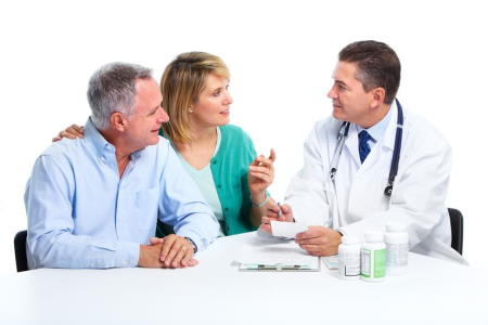 Doctor consulting with couple