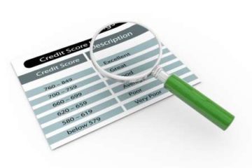Magnifying glass over chart of credit scores