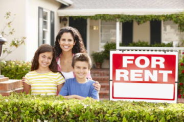 Mother with children in front of "For Rent" sign