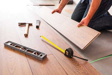 Man installing hardwood flooring