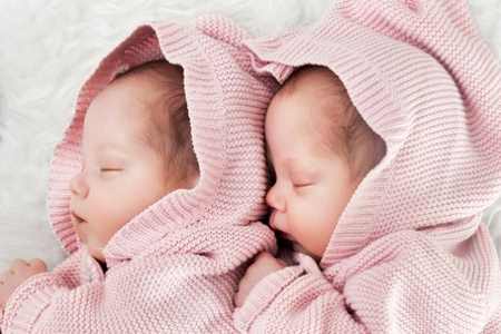 Twins infants in pink born pre-term