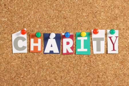 charity in block letters on bulletin board