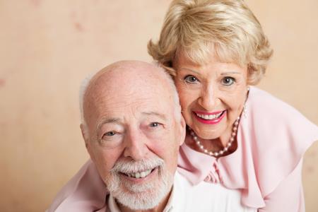 seniors smiling with free dentures